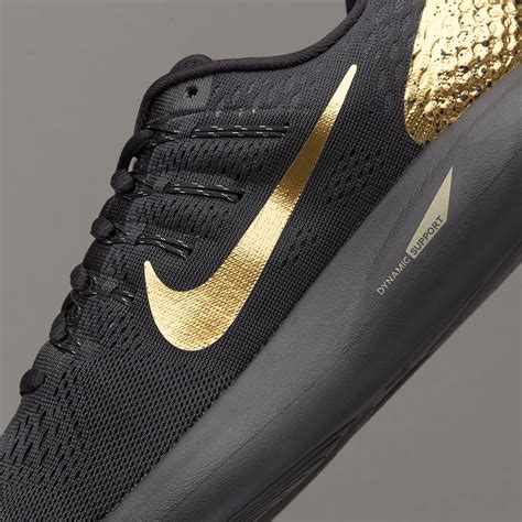 Nike black metallic gold